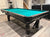 8 FOOT PREOWNED HERRINGTON BILLIARDS POOL TABLE INSTALLED WITH ACCESSORIES