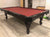 PREOWNED 9 FOOT OLHAUSEN POOL TABLE INSTALLED WITH ACCESSORIES DARK WALNUT FINISH