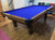9 FOOT PREOWNED DUFFERIN REGENT POOL TABLE INSTALLED WITH ACCESSORIES SMOKY OAK FINISH