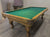 PREOWNED 9 FOOT SOLID WOOD SLATE POOL TABLE INSTALLED WITH ACCESSORIES