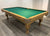 PREOWNED 9 FOOT SOLID WOOD SLATE POOL TABLE INSTALLED WITH ACCESSORIES