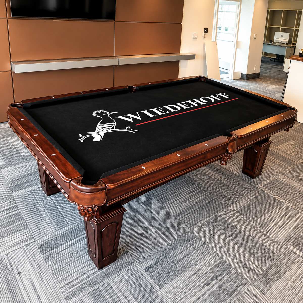 Pool table with custom designed billiard cloth