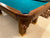 8' PREOWNED DUFFERIN ROYAL POOL TABLE INSTALLED WITH ACCESSORIES. WALNUT FINISH