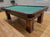 8 FOOT PREOWNED BRUNSWICK CONTENDER POOL TABLE INSTALLED WITH ACCESSORIES WALNUT FINISH