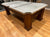 8 FOOT PREOWNED BRUNSWICK CONTENDER POOL TABLE INSTALLED WITH ACCESSORIES WALNUT FINISH