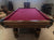 8' PREOWNED DUFFERIN ROYAL POOL TABLE INSTALLED WITH ACCESSORIES. WALNUT FINISH