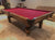 8' PREOWNED DUFFERIN ROYAL POOL TABLE INSTALLED WITH ACCESSORIES. WALNUT FINISH