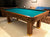 8' PREOWNED DUFFERIN ROYAL POOL TABLE INSTALLED WITH ACCESSORIES. WALNUT FINISH