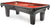 Pool table with red felt surface and billiard accessories on a white background