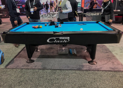 Black base Clash Steele billiard table on the carpet 