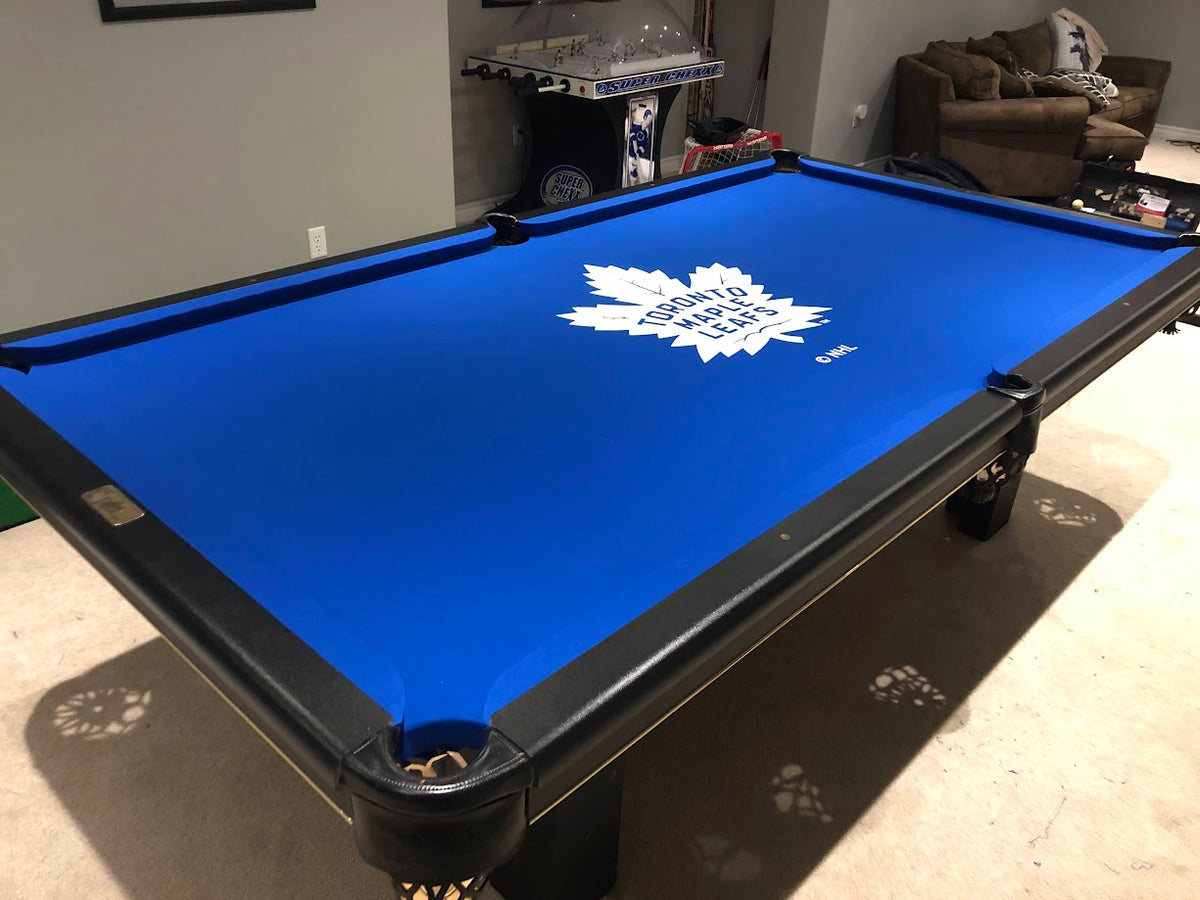 Pool table with custom Toronto Maple Leafs logo billiard cloth