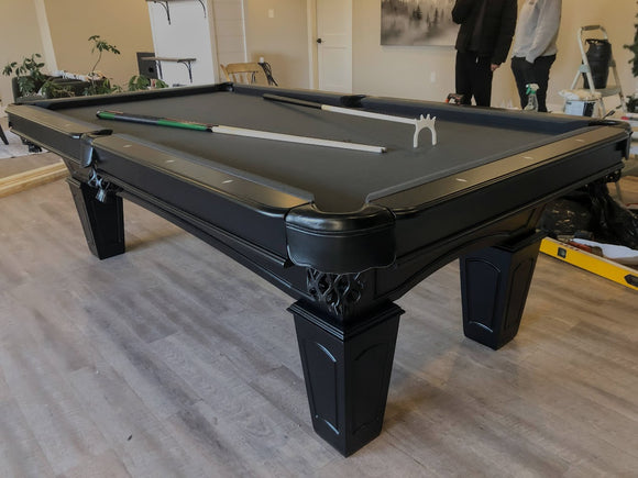 Angle view of Majestic Ascot 8-foot black pool table with leather drop pockets and slate playing surface