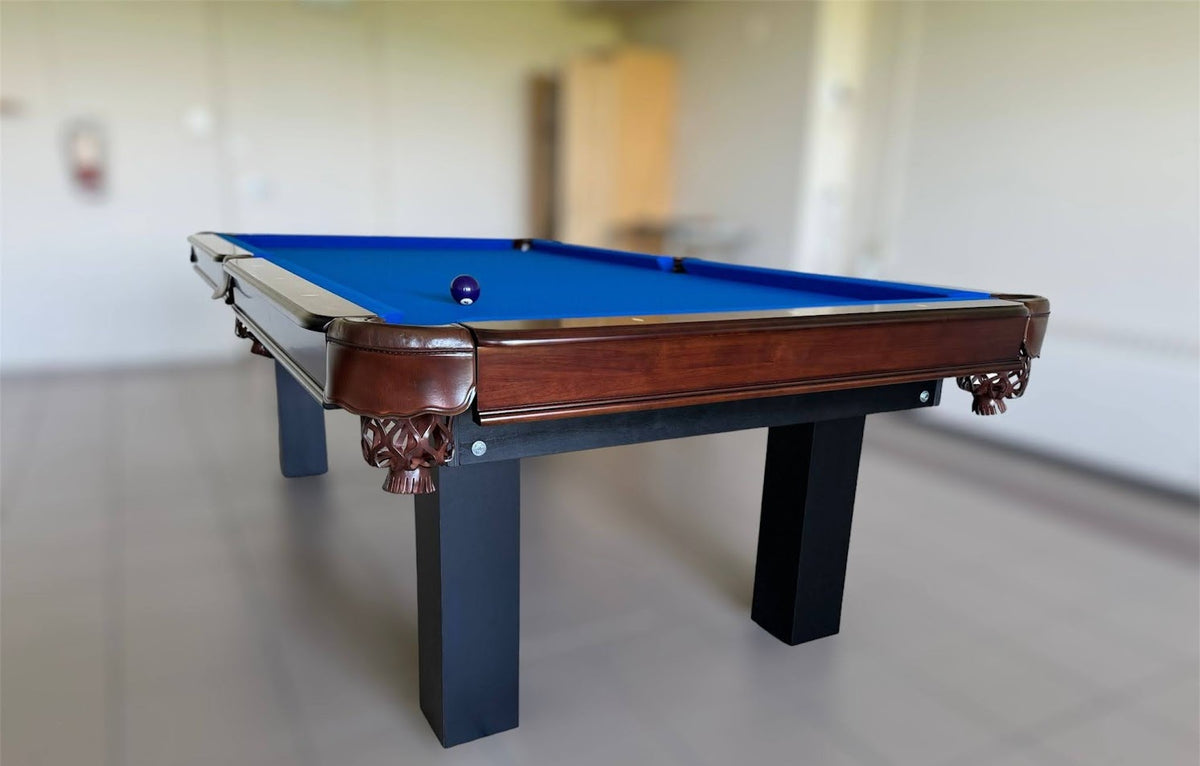 The corner view of Majestic Orleans 7-foot walnut frame and black square legs pool table with leather drop pockets 