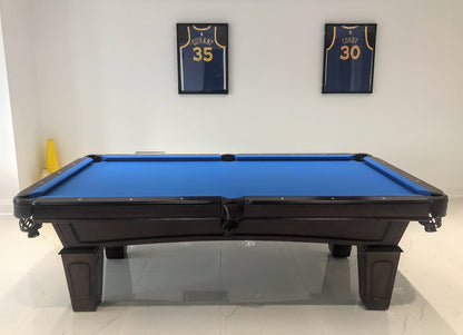 The side view of Majestic Ascot 7-foot walnut pool table with leather drop pockets and blue felt and slate playing surface