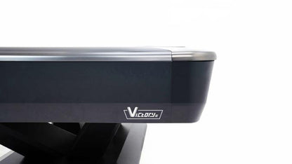 Close-up of a pool table with 'Victory' branding on a white background