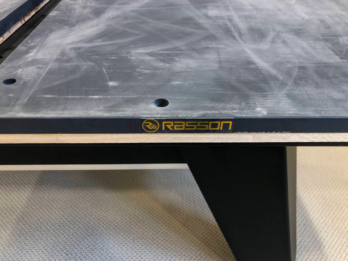 Slate of Rasson billiard table with logo