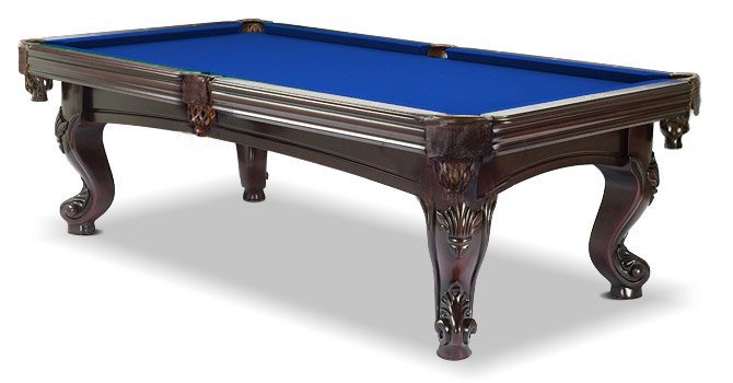 A  mahogany wood pool table with blue cloth top, featuring carved leg designs and leather-fringed pockets.