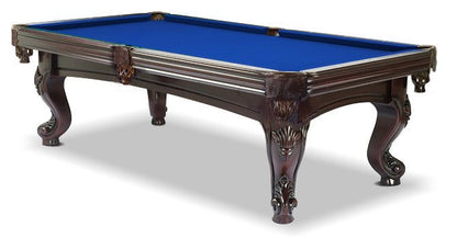 A  mahogany wood pool table with blue cloth top, featuring carved leg designs and leather-fringed pockets.