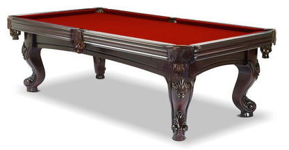A  mahogany wood pool table with red cloth top, featuring carved leg designs and leather-fringed pockets.
